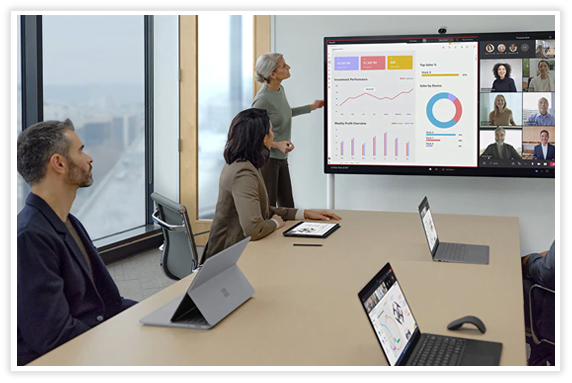 A group of people looking at a screen