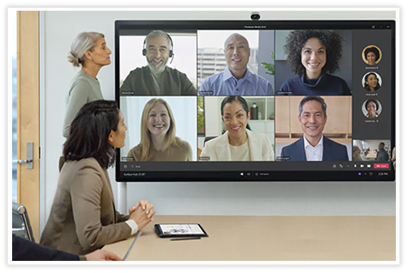 A group of people looking at a screen